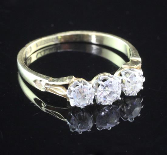 An 18ct gold and three stone diamond ring, size Q.